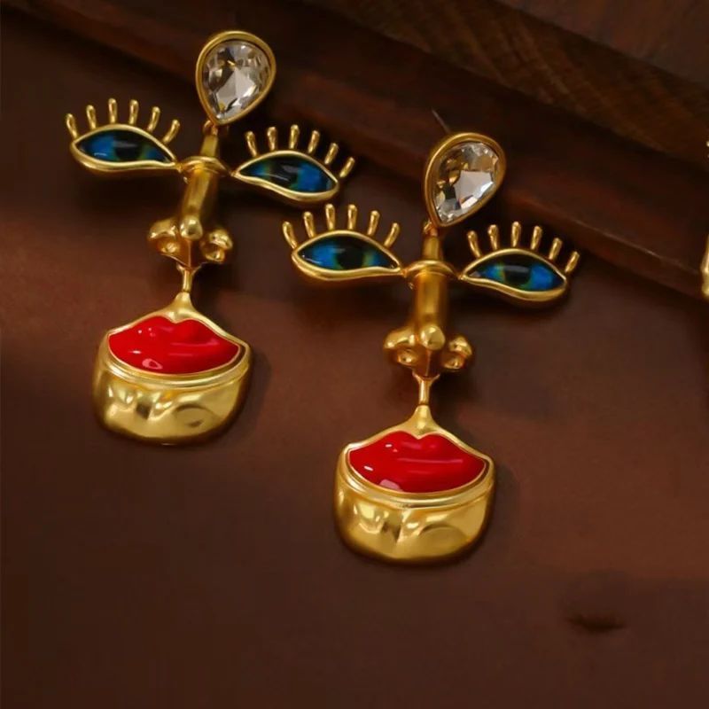 Серьги длинные подвески Лицо глаза губы золотистые Podarkus BK1111-G BK1111-G фото