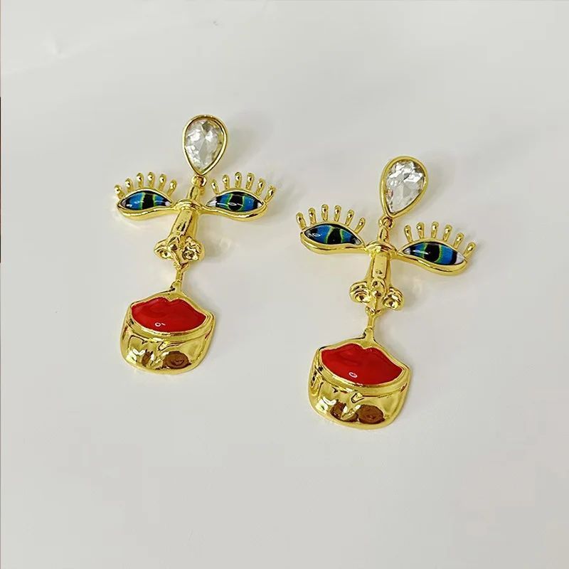 Серьги длинные подвески Лицо глаза губы золотистые Podarkus BK1111-G BK1111-G фото