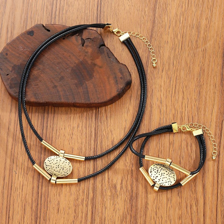 Комплект прикрас на шнурку Чокер та браслет із металевими овалами Золотистий Podarkus BK834-G BK834-G фото